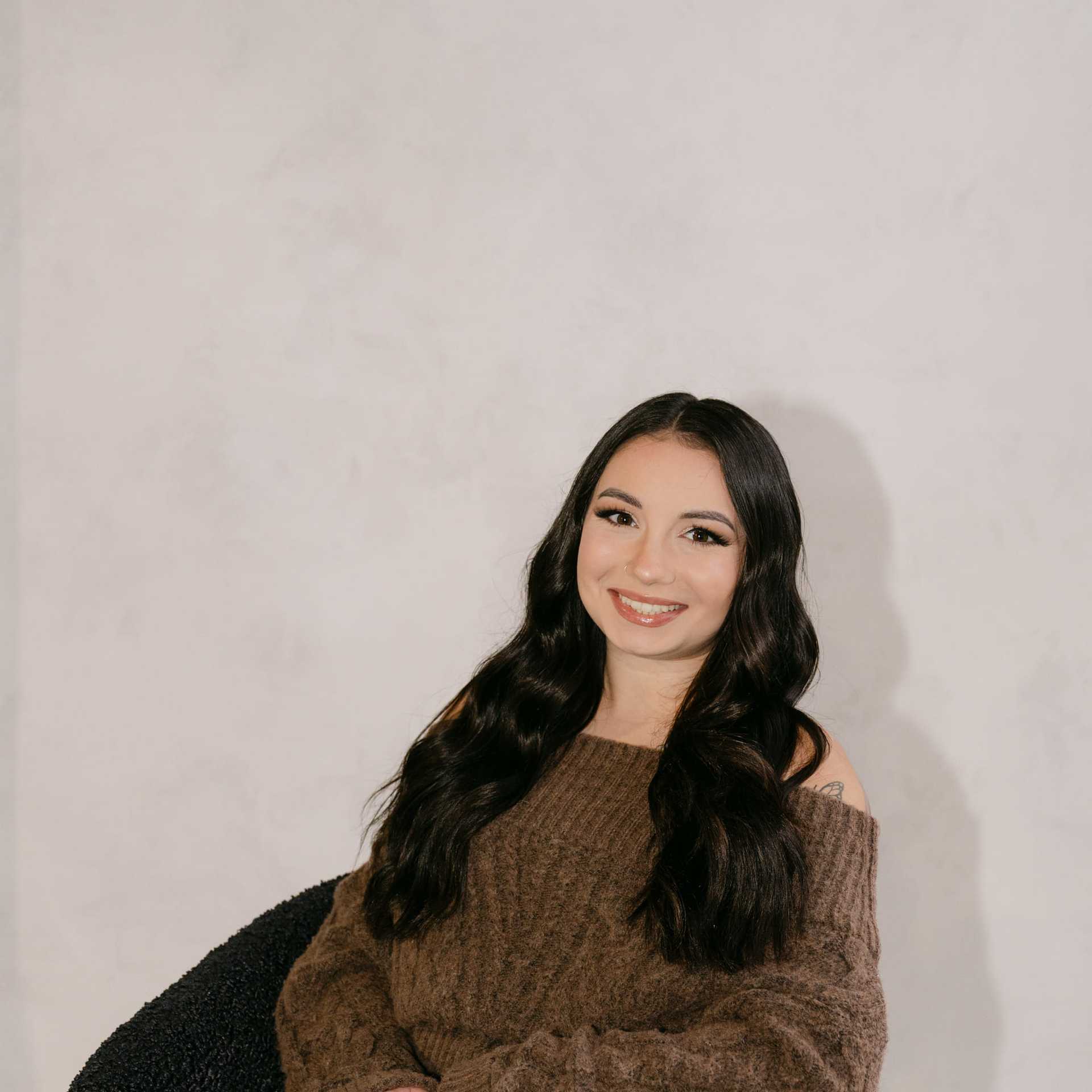 Portrait of Arianna Boprey, a professional stylist at Chromatique Salon, showcasing their expertise and style.